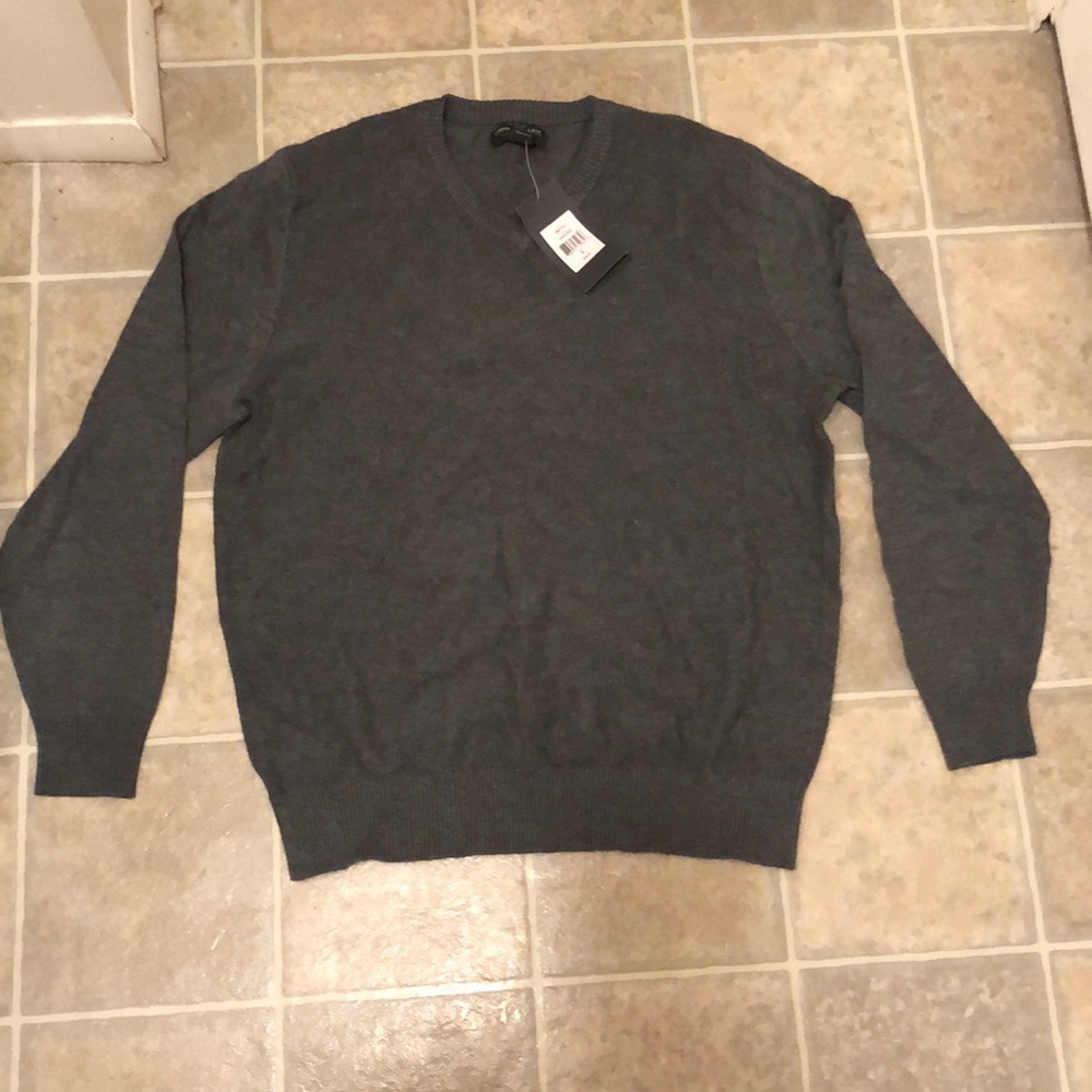 Men’s, grey, medium v-neck sweater.